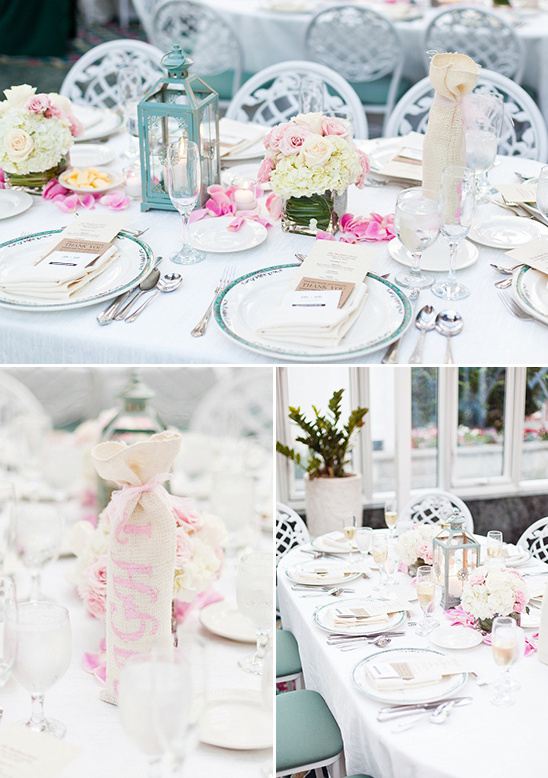 Elegant wedding table setting with floral centerpiece and favors
