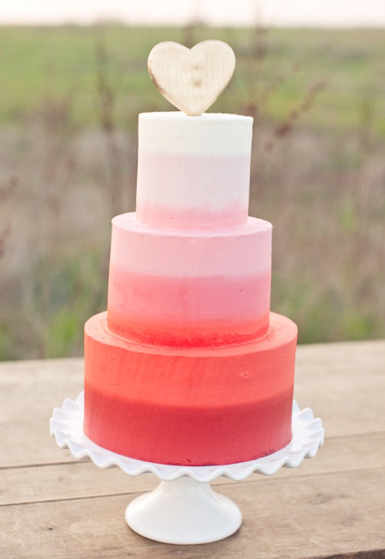 Ombre pink wedding cake with wooden heart topper