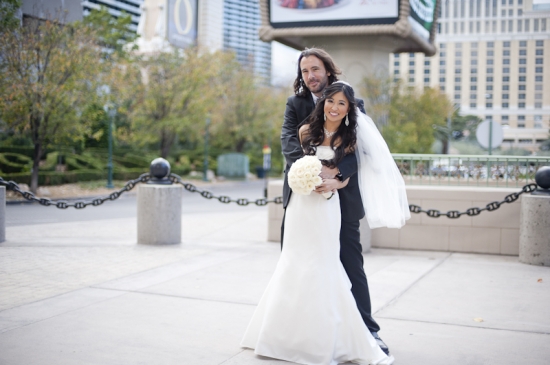 Happy newlywed couple posing for wedding photo