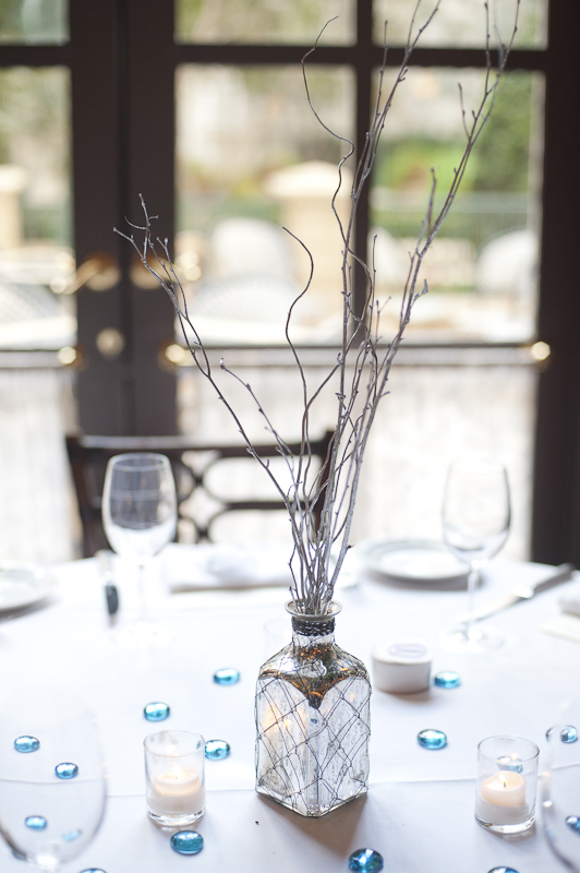 Elegant table centerpiece: silver vase with winter branches