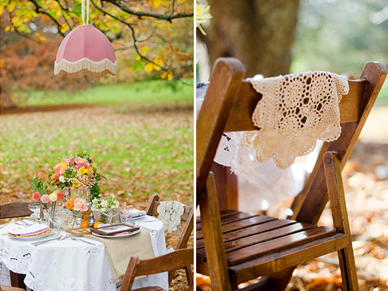 Outdoor party decor with flowers and wooden chairs