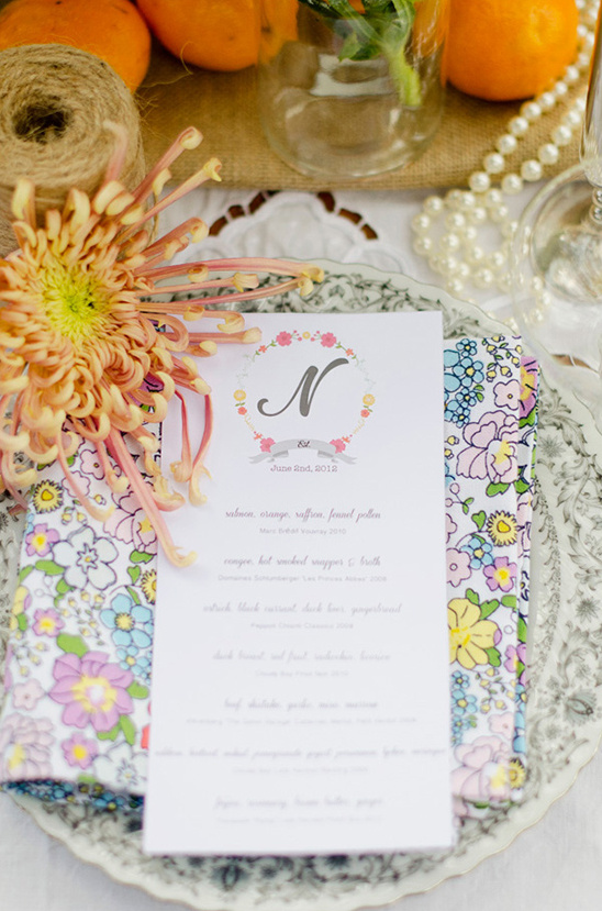 Elegant table setting with floral menu and decorations