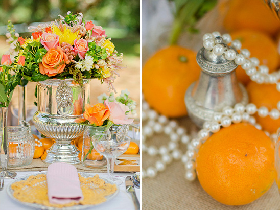 Elegant tablescape with silver flowers and oranges
