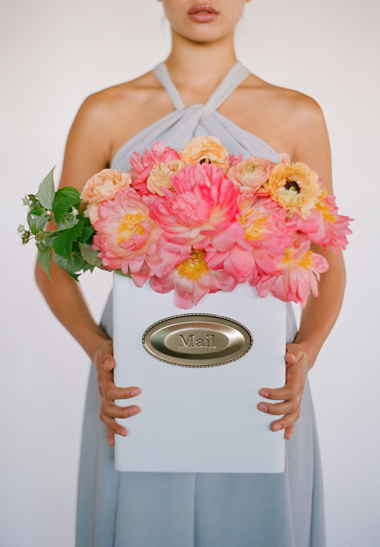 Pretty pink flowers in a white mail box