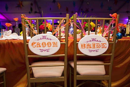 Wedding chairs decorated with Bride and Groom signs