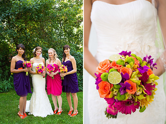 Bride with Bridesmaids holding colorful flowers at a wedding