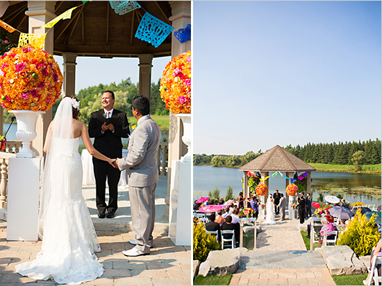 Wedding ceremony at lakeside gazebo with floral decorations