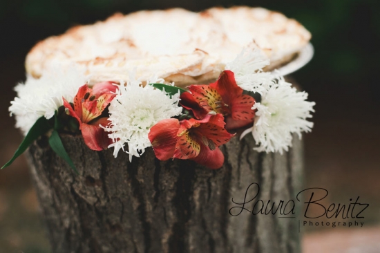 Floral decorated pie on rustic wood base