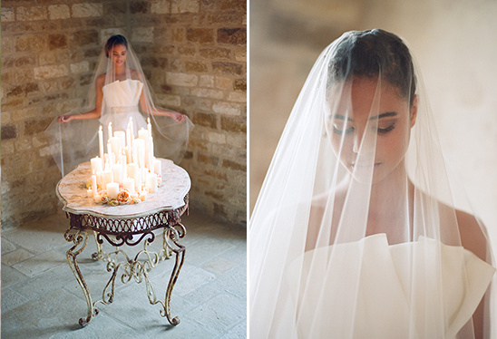 Romantic bride with veil and candles