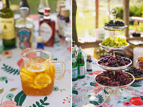 Festive drinks and fruit on a floral tablecloth table