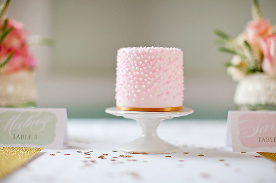 Pink mini cake with dots for place setting wedding
