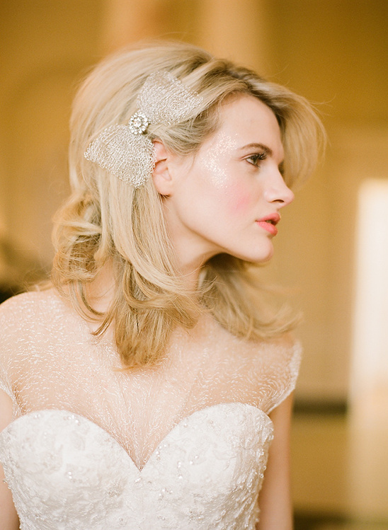 Blonde bride wearing a dress and hair bow