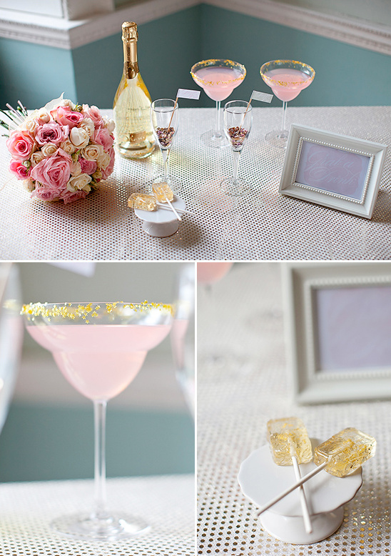 Wedding celebration table with pink cocktails and flowers
