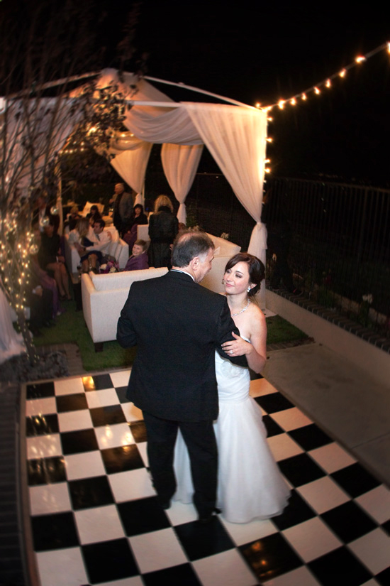 Bride dances with her father at outdoor wedding party