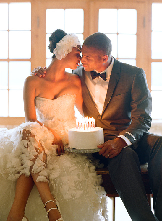 Bride and groom share a wedding cake