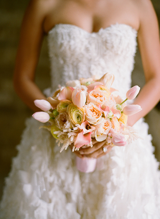 Bride holding a pastel wedding bouquet