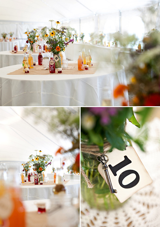Rustic wedding table centerpiece with wildflowers and mason jars