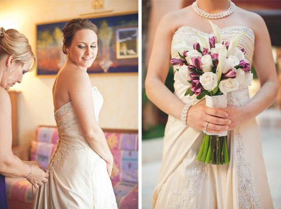 Bride getting ready in her strapless gown with a flower bouquet