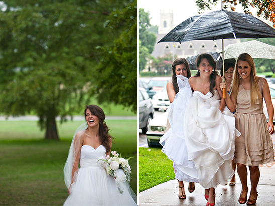 Smiling bride and bridesmaids in rain on wedding day