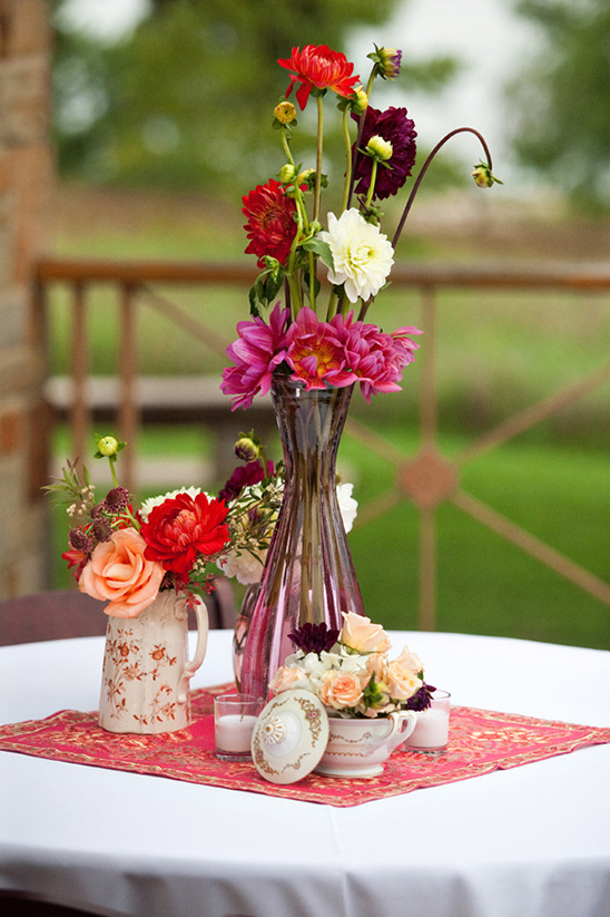 Vibrant dahlia centerpiece in vintage vase, table decor