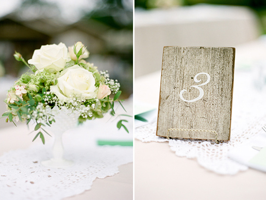 Rustic table number three with white roses