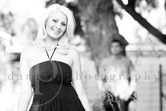 Smiling blonde woman in summer dress, outdoor portrait