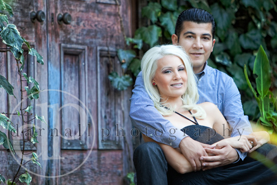 Happy couple embracing near an old door