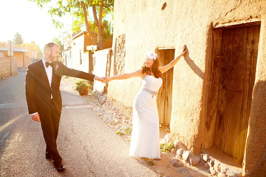 Bride and groom holding hands on their wedding day