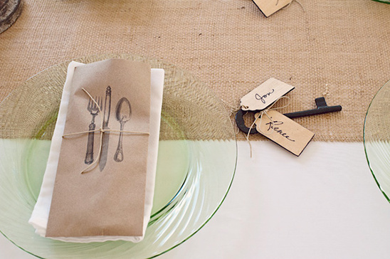 Rustic place setting with engraved cutlery and key tags