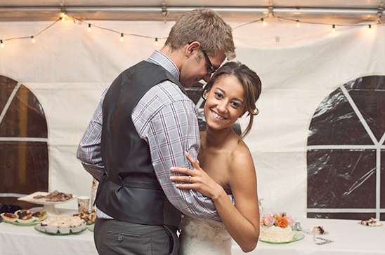 Bride and groom enjoy first dance at wedding reception