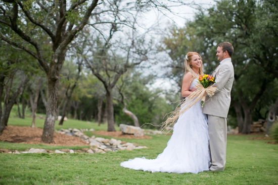 Bride and groom in a rustic outdoor wedding setting