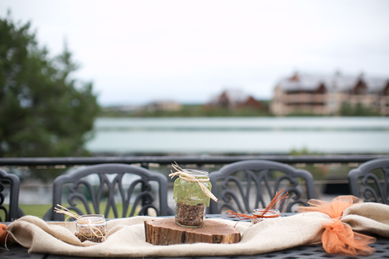 Rustic outdoor table setting with burlap and jars