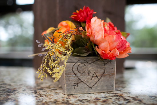 Floral centerpiece in wooden box with heart initials
