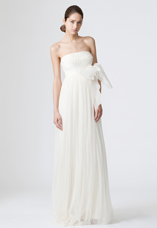 Strapless wedding dress with bow detail on waist