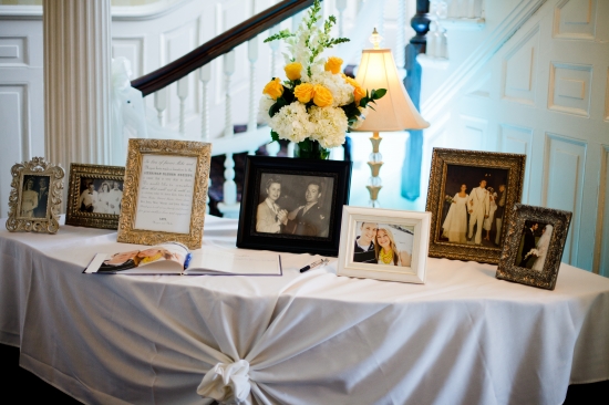 Wedding reception table with framed family photos