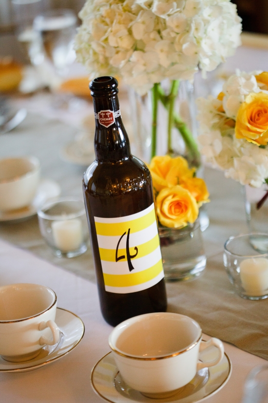 Elegant table decor with number four bottle and flowers