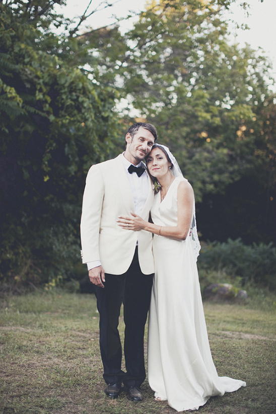 Happy wedding couple posing outdoors