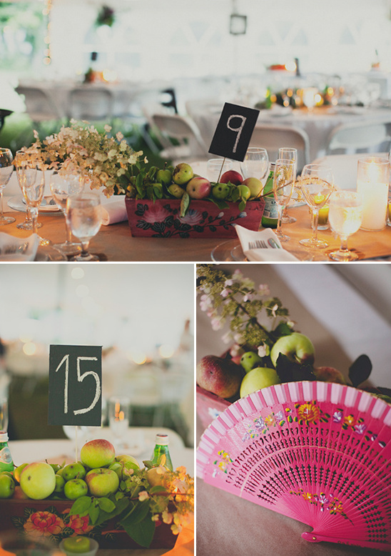 Rustic wedding table centerpiece with apples and chalkboard number