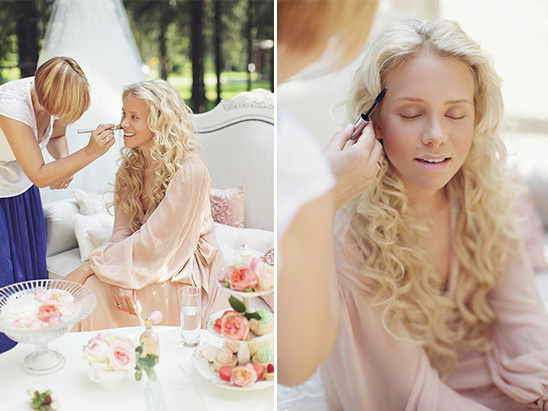 Woman getting makeup applied outdoors