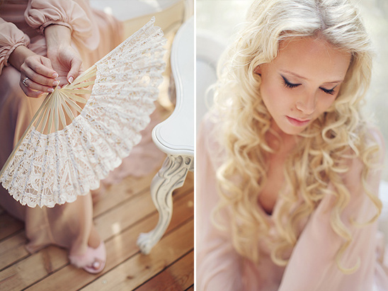 Woman with lace fan and blonde hair