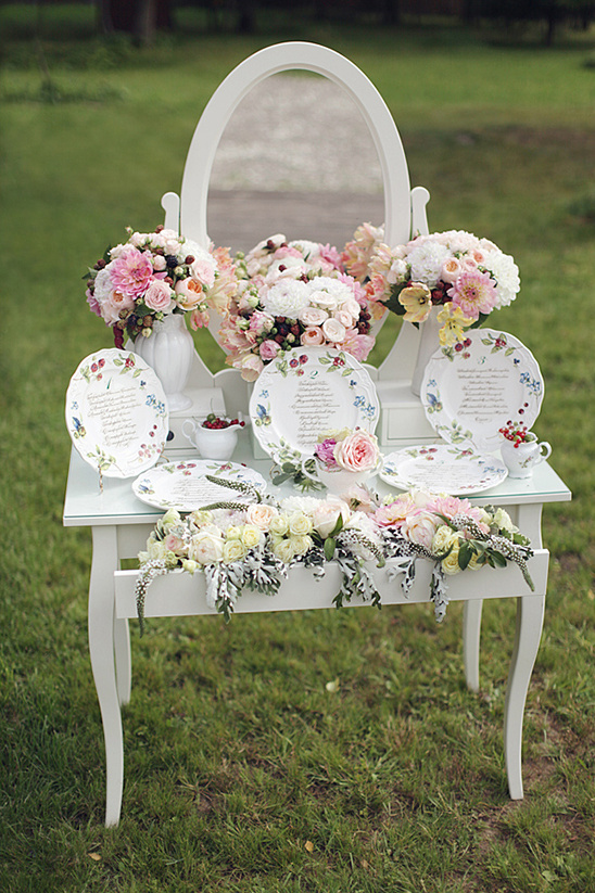 Romantic wedding table setting with flowers and plates