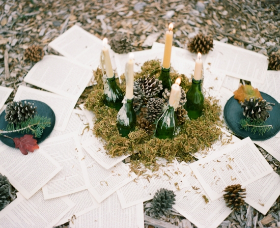 Unique table decor with candles in bottles and book pages