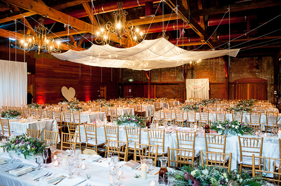 Elegant wedding reception venue with beautifully set tables and decor