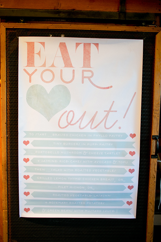 Menu sign saying Eat Your Out with food options listed