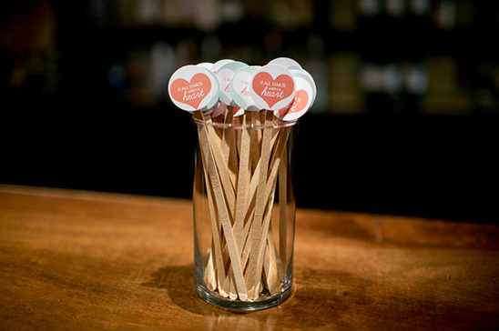 Heart shaped stir sticks in a glass, perfect for special occasions