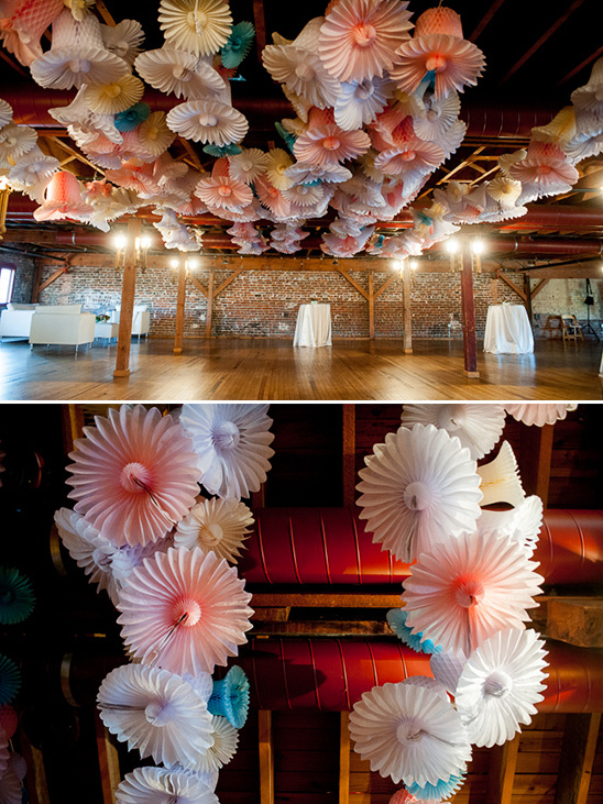 Wedding venue with beautiful paper flower ceiling decorations