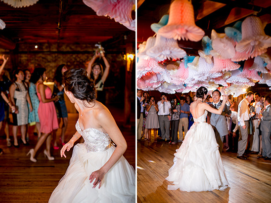 Bride throwing the bouquet during wedding celebration