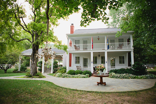 White colonial house with porch and gazebo