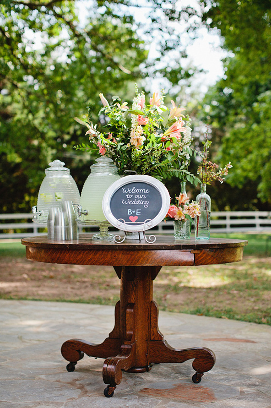 Wedding welcome sign table with drinks