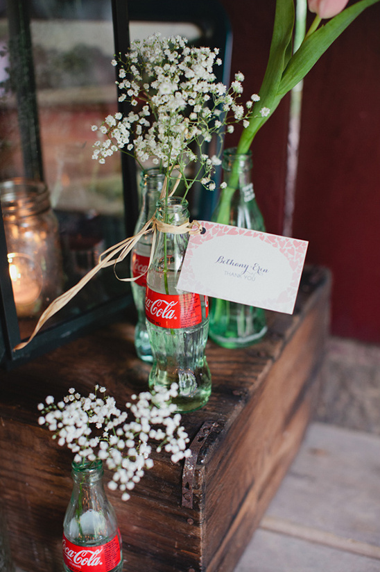Small white flowers in vintage bottles